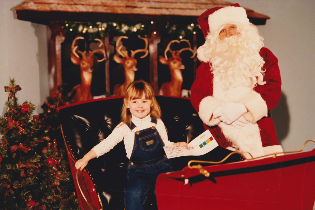 Naughty little Diana makes Santa get out of the sleigh so she could drive.