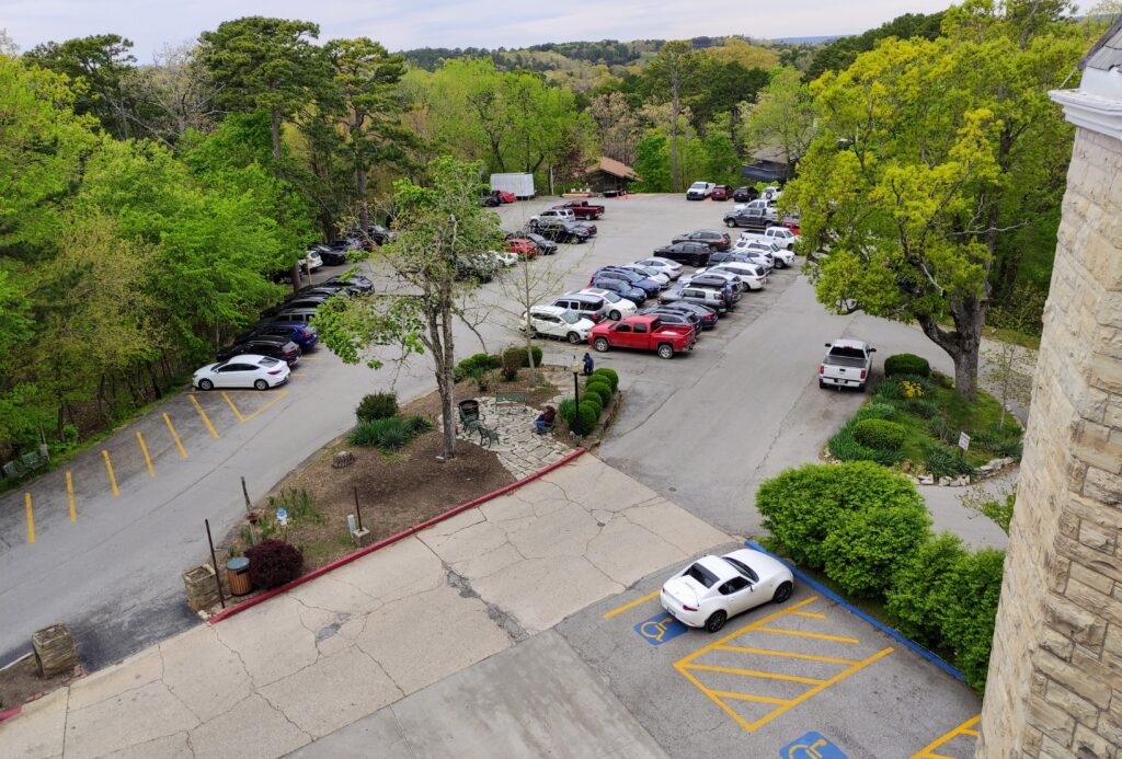 Ample parking lot with several motorcycle parking spots at the Crescent Hotel Eureka Springs