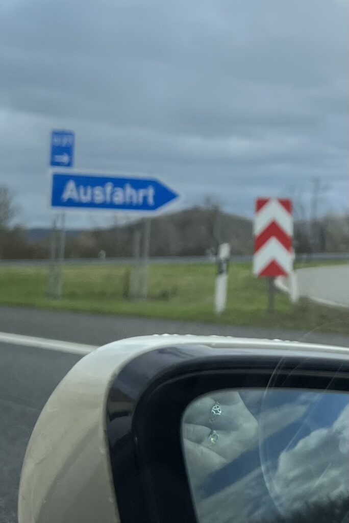 An Autobahn exit sign reading "Ausfahrt"