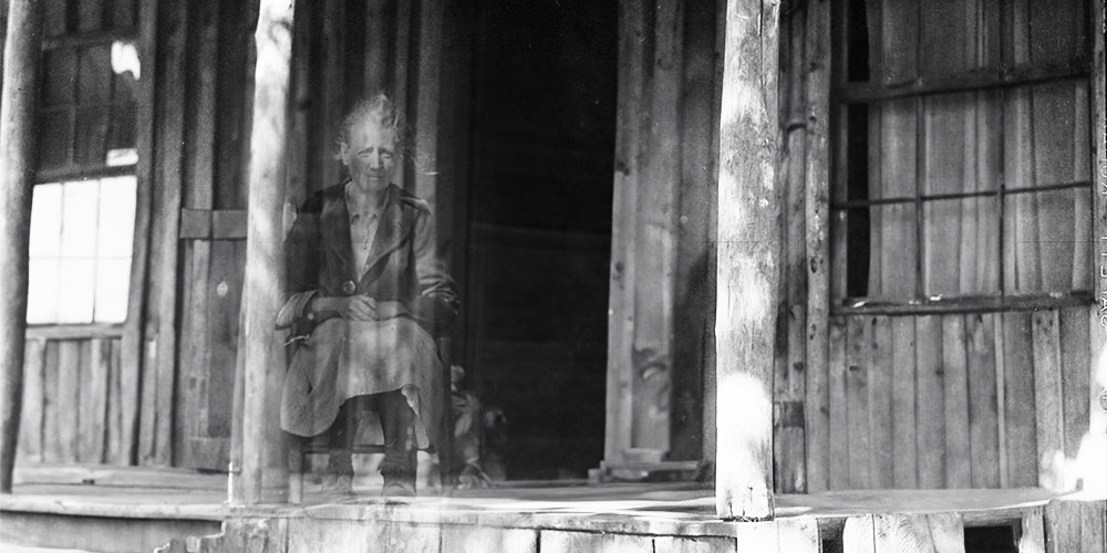 The ethereal spirit of an Appalachian Granny Woman on a southern porch