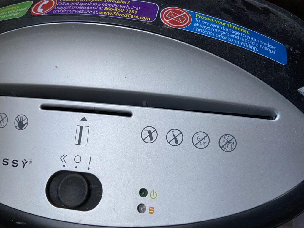Diana's shredder, with a clear "no neckties!" pictograph.