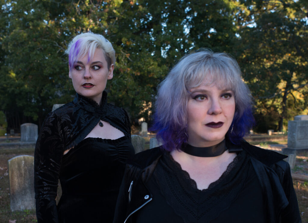 Becky and Diana in a cemetery in Georgia, looking spooky and dressed in all black.